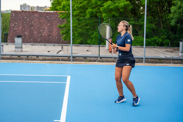 Fototapeta premium Professional female tennis player playing the tennis on outside court