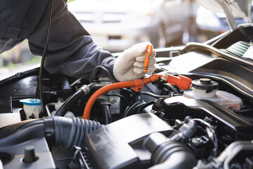 Fototapeta premium Auto check, car service shop concept. Automobile repairman work checking change engine oil, lubricant to estimate repair motor machine by engineer, mechanic inspecting maintenance at vehicle garage.