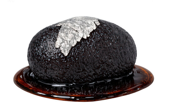 Kala jamun sweet with edible silver varak leaf, an indian traditional dark brown dessert in sugar syrup, transparent background