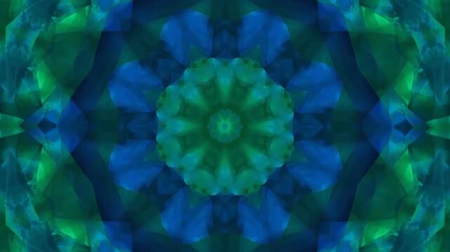 A vibrant, symmetrical pattern with floral elements in shades of green and blue, creating a kaleidoscope effect from a central viewpoint in Video