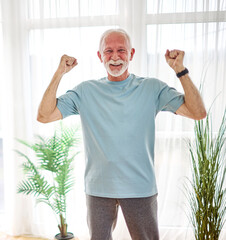 Portrait of a senior elderly woman and man, a couple, exercising at home or in the gym, workout and training. Mature female and male person happy doing cardio exercise for health, exercising and stret
