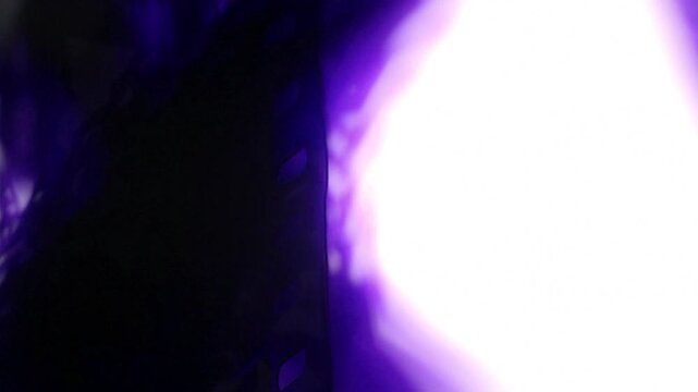 film burn transition with blue and red light flares and dust particles. This footage is ideal for overlaying on video clips to create a vintage or dramatic effect.