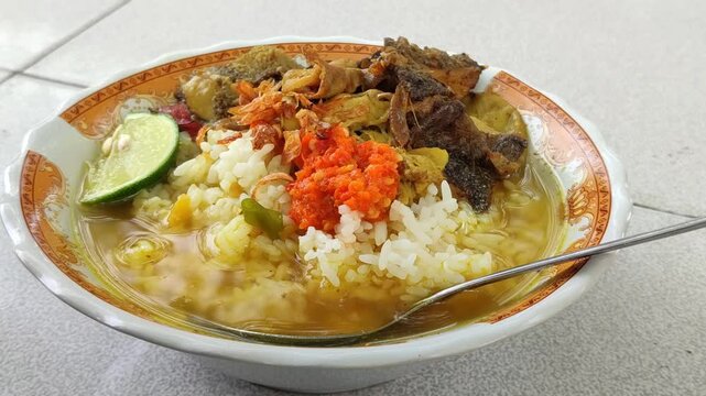 Traditional Indonesian soto babat served with savory broth and beef tripe, showcasing authentic local culinary heritage.