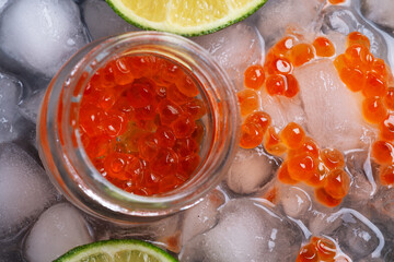  fresh red  salmon caviar with lime around ice. macro shot.  Protein  delicacy  healthy food. flat lay