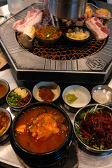 BBQ dinner table with various foods
