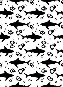 Repeating pattern featuring black shark silhouettes and bubbles on a white background
