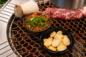 various foods on the charcoal BBQ grill