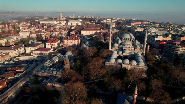 Wide aerial view of Sehzade Mosque and its kulliye in the Fatih district of Istanbul. Ottoman architecture, dome composition and dense urban surroundings reveal the scale of the historic peninsula.