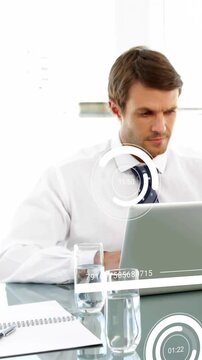 Vertical video: Office mgr typing on laptop starting business HUD timers and progress bars for KPIs