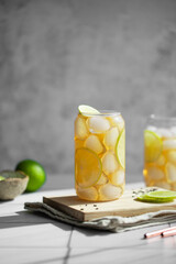 Fototapeta premium Refreshing Iced Tea with Lemon and Lime in Glass Jar, Healthy Summer Drink