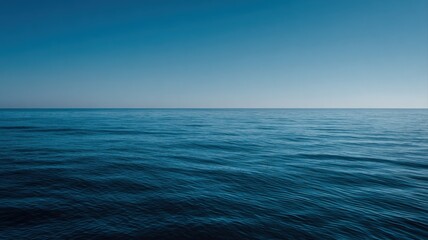 Fototapeta premium Endless Ocean Horizon with Tranquil Blue Waters and Clear Sky for Backgrounds and Serene Concepts