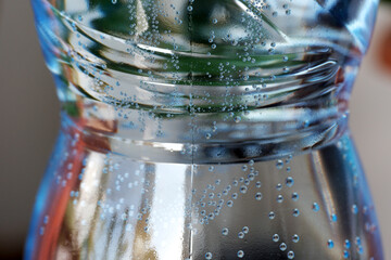 Refreshing bubbles dance in a bottle of sparkling water