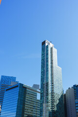 Fototapeta premium Modern Glass Skyscraper Rising Above New York