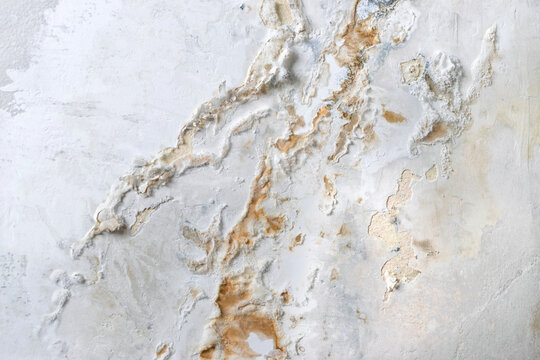 Blistered wall paint caused by trapped moisture and poor ventilation