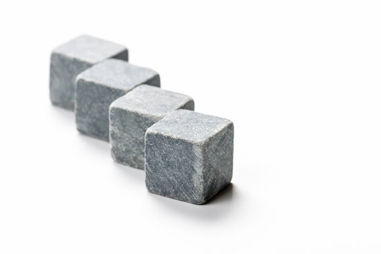 Square stones lined up to cool whiskey.