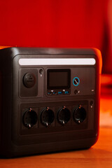 Portable power station with multiple outlets ready for outdoor use in a home setting