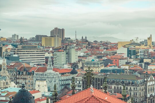 Stunning views capture the charming blend of traditional and modern architecture in Porto, showcasing vibrant rooftops and the iconic skyline along the Douro River