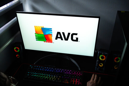 Punta Arenas, Chile &ndash; February 17, 2026: A person at a desk with the AVG antivirus software logo displayed on a computer monitor