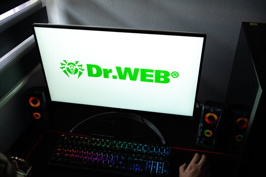 Punta Arenas, Chile &ndash; February 18, 2026: A person at a desk with the Dr.Web antivirus security software logo displayed on a computer monitor