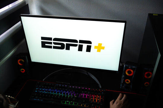 Punta Arenas, Chile &ndash; February 18, 2026: A person at a desk with the ESPN+ sports streaming service logo displayed on a computer monitor