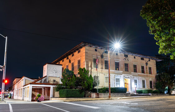 Standard Oil Company Building in Jackson, Mississippi. Historic Italian Renaissance Revival architecture features a stucco facade and a white clock tower at North State Street and East Amite Street