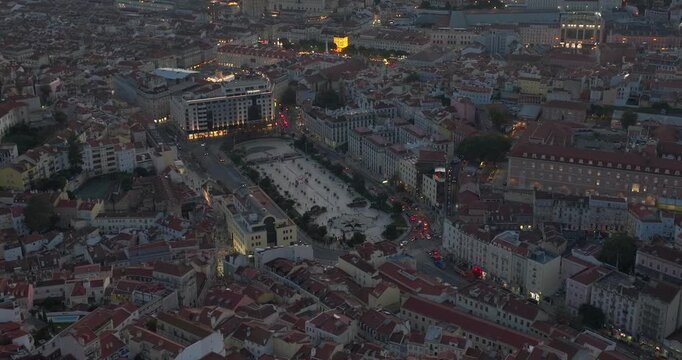 Aerial drone night shot from Lisbon over Martim Moniz and central area with Rossio Square and Praca Commercial