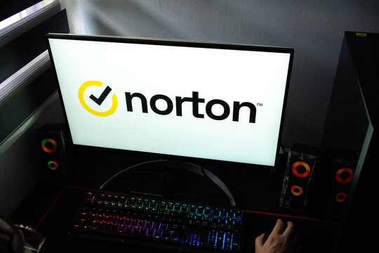 Punta Arenas, Chile &ndash; February 18, 2026: A person at a desk with the Norton 360 cybersecurity and antivirus software logo displayed on a computer monitor