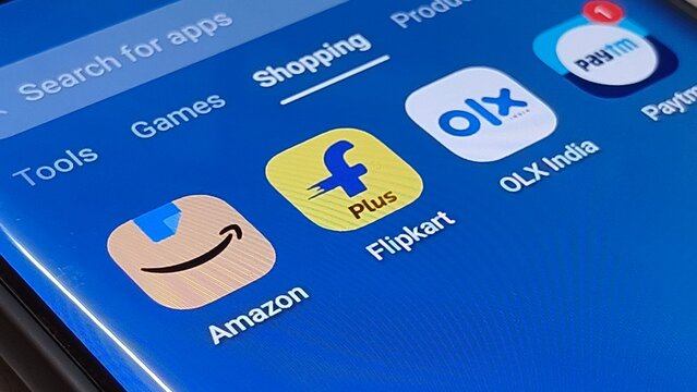 Ecommerce apps on mobile device screen with shopping icons