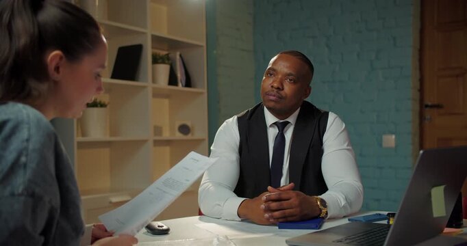 Business consultant listening to client in office