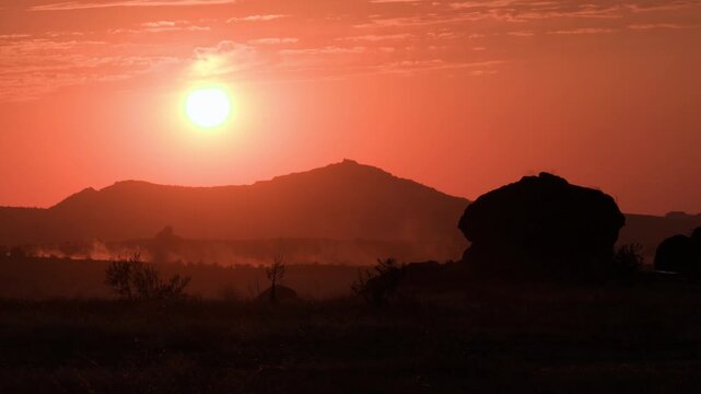 Cinematic orange sunset in mountain valley