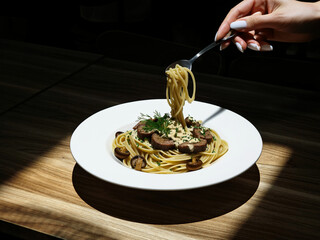 mushroom pasta and steak on a plate