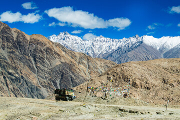 Snowy Himalayan peaks, blue sky at Chang La,southern pass, high mountain pass in Ladakh in the Greater Himalaya between Leh and the Shyok River valley. Leh to Pangong Lake road. Leh, Ladakh, India.