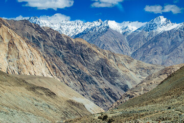 Snowy Himalayan peaks, blue sky at Chang La,southern pass, high mountain pass in Ladakh in the Greater Himalaya between Leh and the Shyok River valley. Leh to Pangong Lake road. Leh, Ladakh, India.