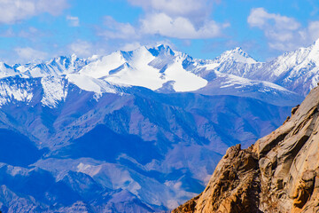 Snowy Himalayan peaks, blue sky at Chang La,southern pass, high mountain pass in Ladakh in the Greater Himalaya between Leh and the Shyok River valley. Leh to Pangong Lake road. Leh, Ladakh, India.