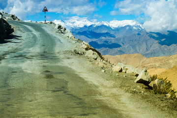 High altitude Motorable road, Leh, Ladakh, India. Chang La , southern pass, is a high mountain pass in Ladakh in the Greater Himalaya between Leh and the Shyok River valley. Leh to Pangong Lake road.