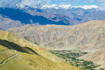 High altitude Motorable road, Leh, Ladakh, India. Chang La , southern pass, is a high mountain pass in Ladakh in the Greater Himalaya between Leh and the Shyok River valley. Leh to Pangong Lake road.