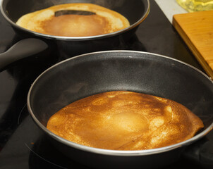 making very thin pancakes with Choux pastry, bubbly lacy texture 
