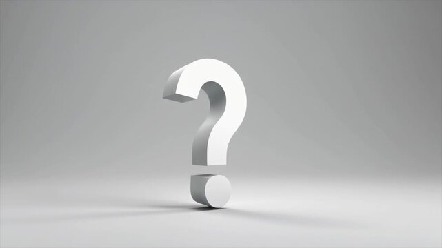 A large, white 3D question mark symbol casting a shadow on a grey surface punctuation query