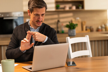 Man Counting On Fingers On Video Call