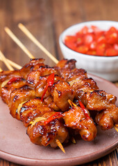 chinese chicken skewers on a plate