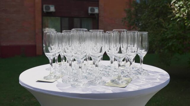 Empty champagne glasses on a table outdoors