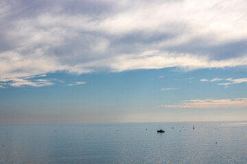 Fototapeta premium Beautiful seascape of the Amalfi Coast in Italy during a colorful sunset at dusk
