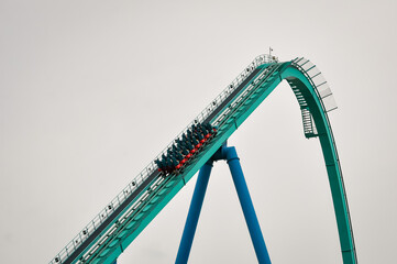 Obraz premium Roller coaster ride going up on the track