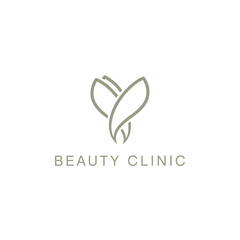 Simple elegant beauty clinic logo with leaves symbol
