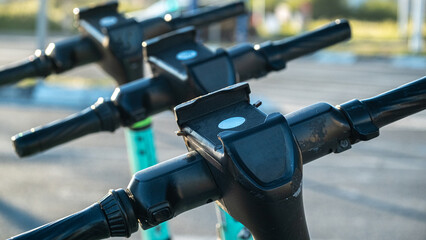Electric Scooter Handlebars in Urban Parking Area