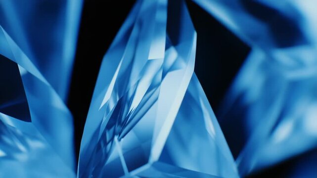 Blue crystal facets reflecting light into sharp geometric shapes, evoking clarity, luxury and abstract elegance with sapphire tones, sparkle and clean modern structure