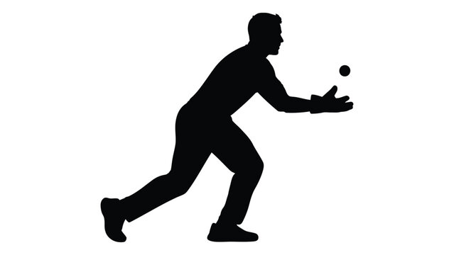 Silhouette of a man attempting to catch a small round object likely a ball