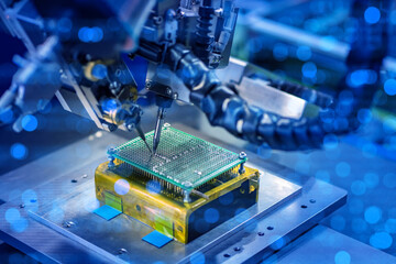 Electronics manufacturing, robotics. Automated machine solders components on printed circuit board...