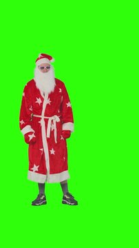 Santa Claus or Father Frost, Ded Moroz, dancing energetically against a green screen background. Green Screen Person. Chroma key people.