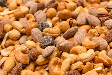 A group of almonds, pistachios, walnuts, macadamia, cashews.
